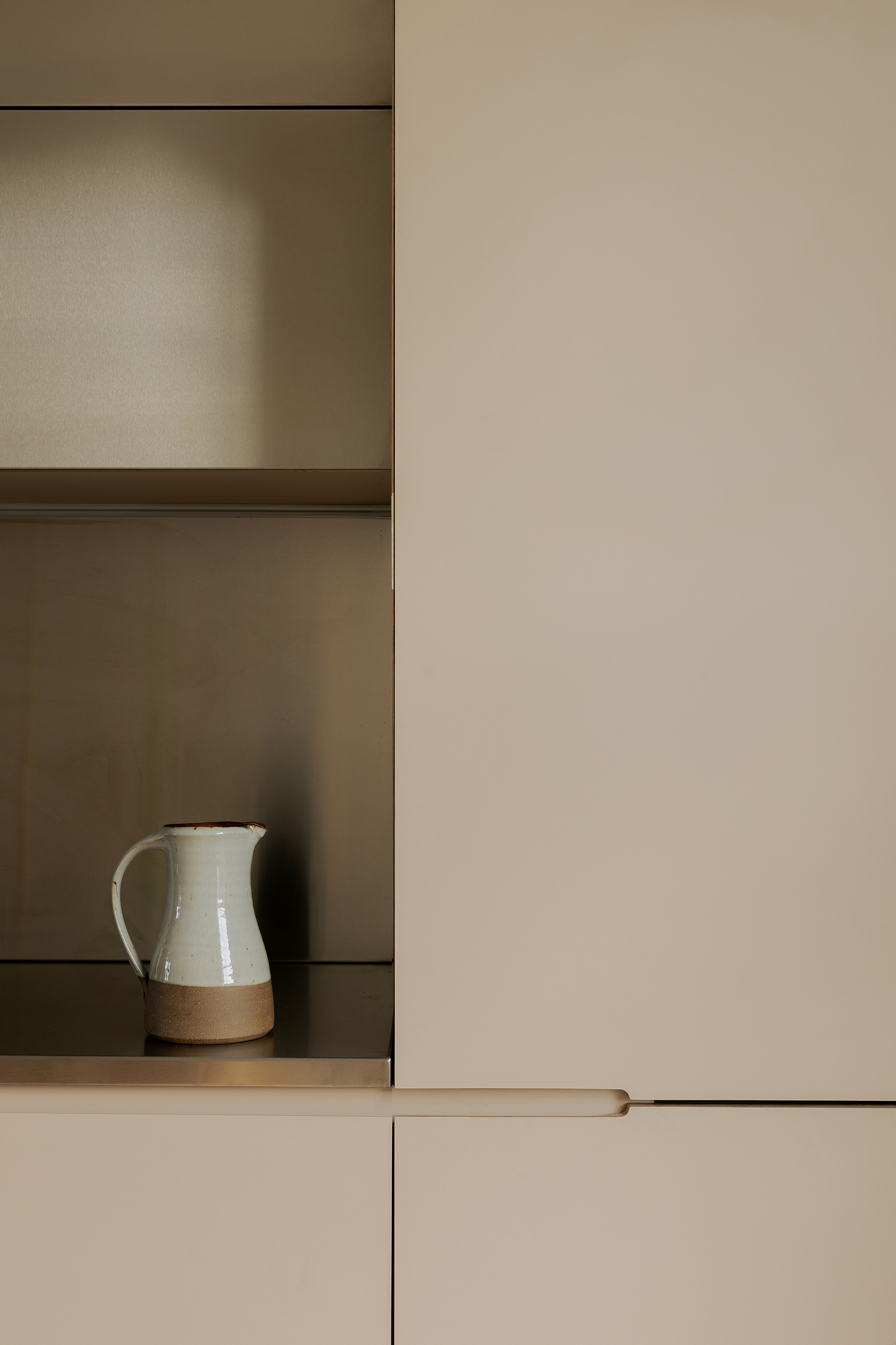 Detail of kitchen materials in grey and stainless steel